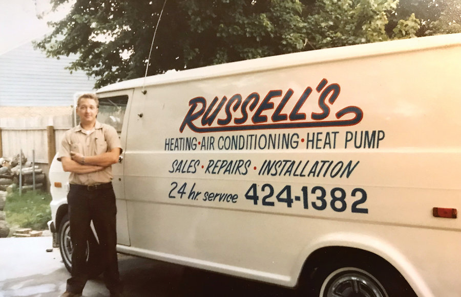 Founder Russell Smith and the company van in the late 1970s. 