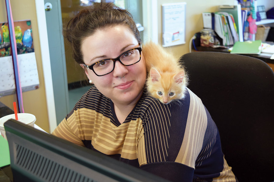 Staff member Jessica Luther poses with one of the Portsmouth Humane Societyâ€™s furry guests awaiting adoption.