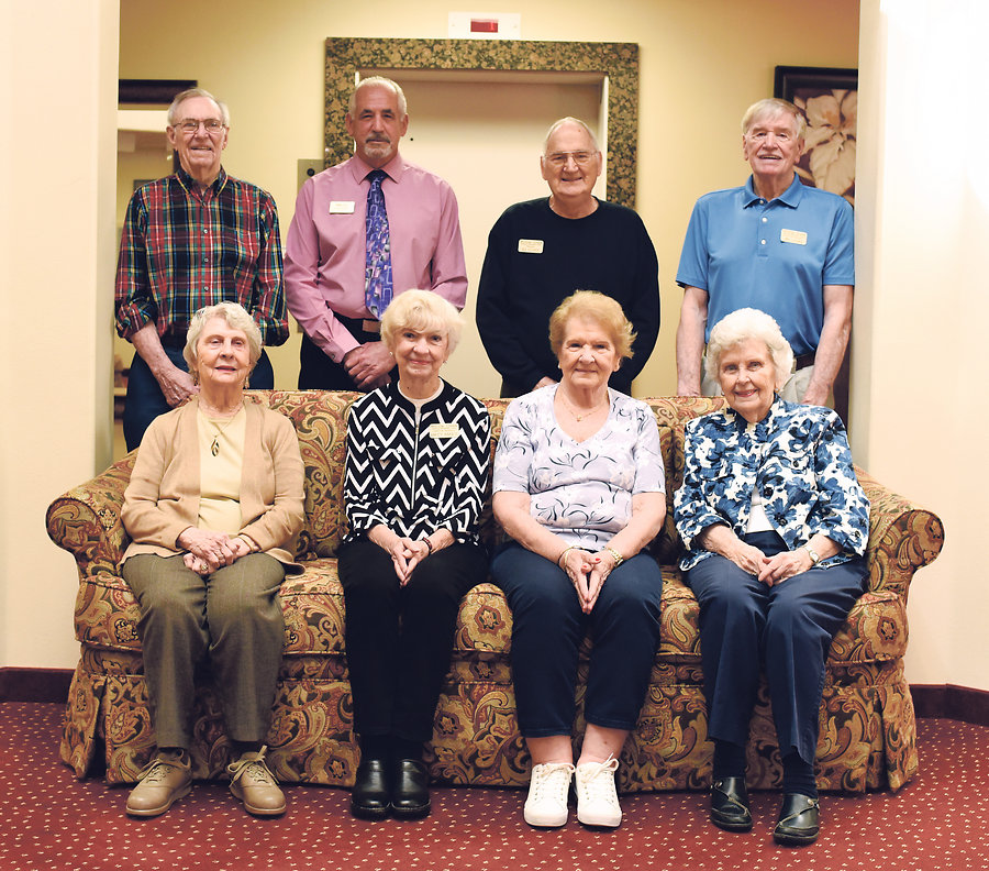These happy retirees enjoy the independence and sense of community at Willow Creek. <BR>Standing, from left: John Barnes, Glenn Campbell, Jim Alkire, Jim Lucas. <BR>Seated, from left: Joan Barnes, Mikey Maier, Marge Barnaby, Mary Penuel.       <BR>            Photo by Michele Thompson