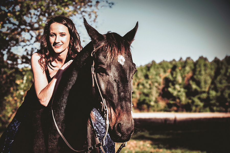 Owner Michele Barkhurst with her horse, Rebel. Photo by M.E. Lucas Photography