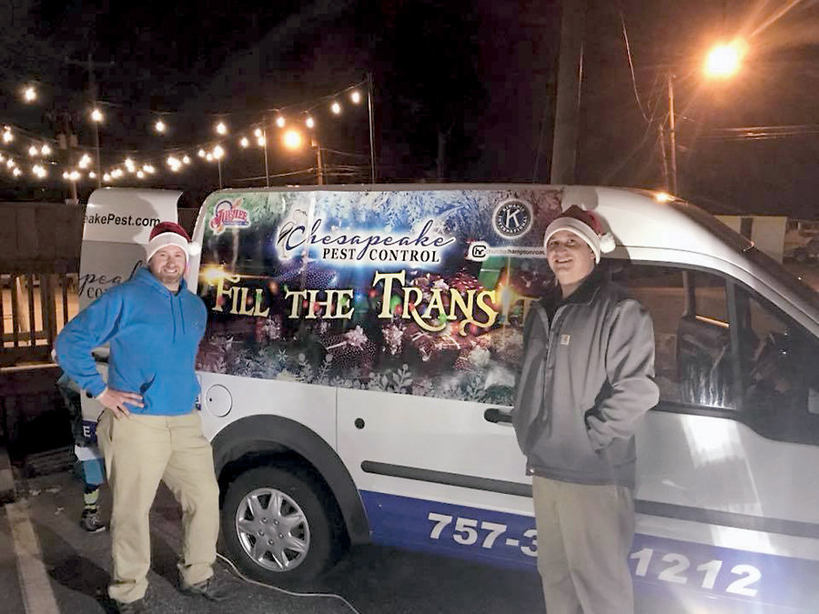 Chesapeake Pest Control supports numerous area charities. Above are George Spence and Adam Wallace with a transit truck full of Toys for Tots donations.