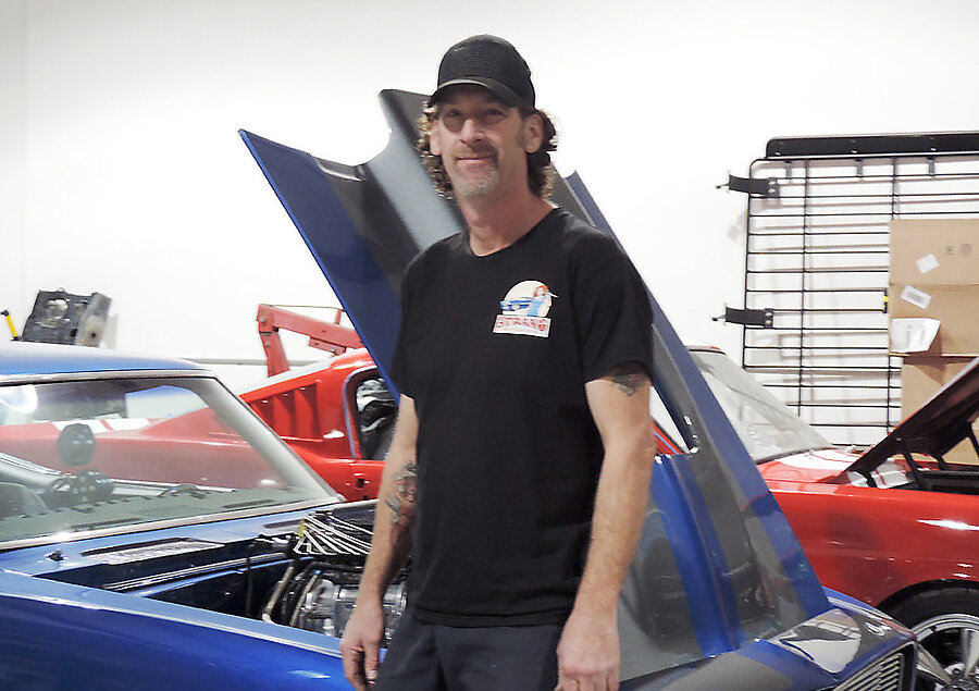 Chris Strang and a restored ‘68 Camaro